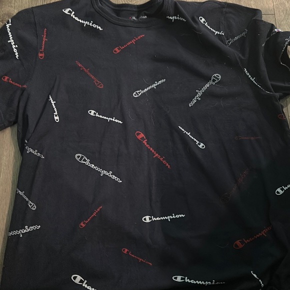 Black Champions tee shirt with the work champion written on the shirt - Picture 1 of 2